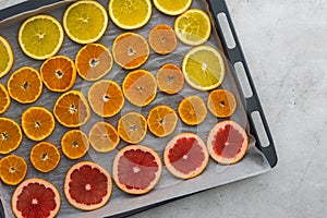 Sliced citrus on baking sheet