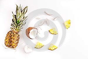 Sliced coconut and pineapple in exotic summer fruit design white background top view mock-up