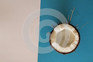Sliced coconut on white and blue background