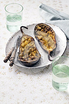 Sliced cooked eggplants with olive oil on a plate