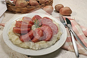 Sliced cotechino with mashed potatoes