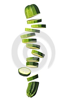 Sliced Courgette (Zucchini) Flying on White