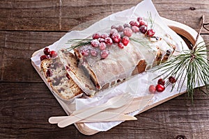 Sliced cranberry pound cake over rustic wooden background