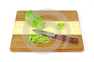 Sliced cubanelle chili pepper on cutting board