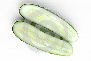 Sliced cucumber over white background