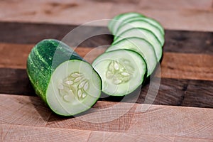 Sliced Cucumber On Wooden Butcher Block Cutting Block 