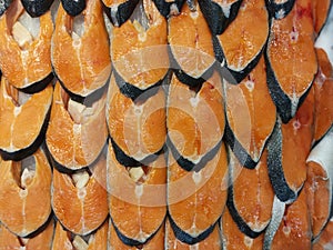 sliced or cut ready fresh salmon fish meat for sale.