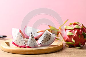 Sliced dragon fruit or pitaya on pink background