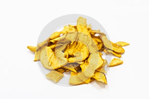 Sliced and dried apples on a conveyor belt in food processing facility