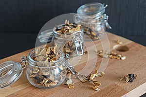 Sliced and dried various mushrooms in three preserving glass bow