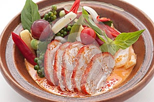 Sliced duck with chily, grapes and cherry tomato photo
