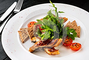 Sliced eel in flavored soy sauce glaze.