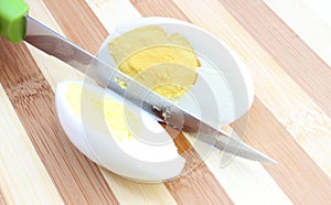 Sliced egg with knife