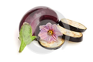 Sliced eggplant or aubergine vegetable with flower isolated on white background