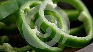 Sliced farm grown green bell pepper close up. Bio vegetable healthy ingredient.