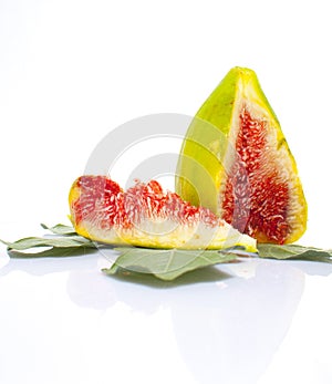 Sliced fig fruit on a leaf