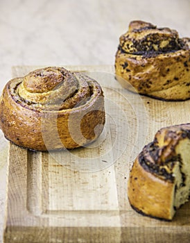 Sliced fresh baking cake with jam and poppy seeds