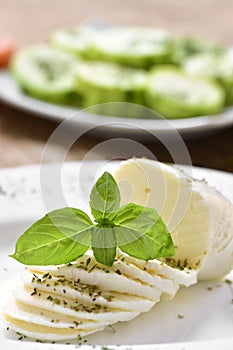 Sliced fresh cheese in a plate