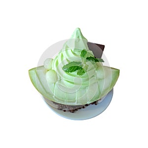 Sliced fresh Japanese melon topping with soft serve ice cream melon. Summer healthy dessert isolated with clipping path