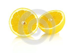 Sliced fresh lemon fruit isolated on white background with shadow reflection.