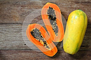 Sliced fresh papaya on wooden