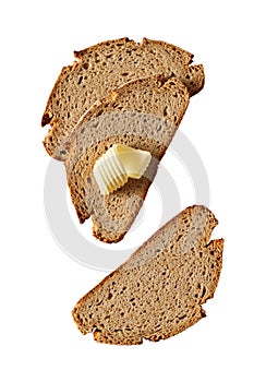 Sliced fresh rye bread with a curl of butter