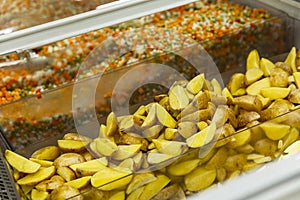 Sliced frozen potatoes in a refrigerator in a supermarket. Close-up. Health and ready-made semi-finished products