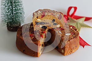 Sliced fruit cake with rum soaked fruits and nuts prepared for christmas