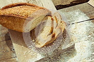 Sliced gluten free bread on wooden table