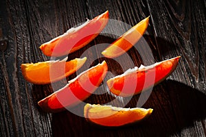 sliced grapefruit orange on wood