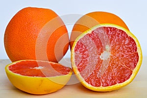 Sliced grapefruit on a white cutting board