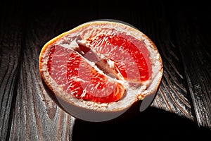 sliced grapefruit on wood