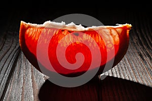 sliced grapefruit on wood