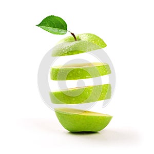 Sliced green apple levitating on white photo