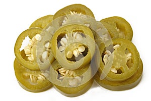 sliced green jalapeno peppers on white background