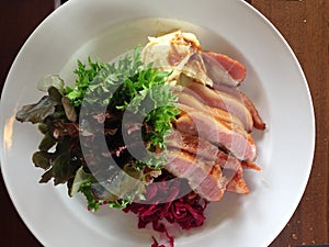 Sliced Grill Pork With Mash Potato and salad