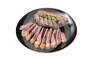 Sliced grilled medium rare Top sirloin beef steak on a plate. Isolated on white background.