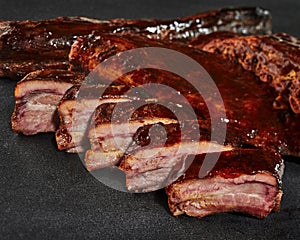 Sliced grilled pork ribs with barbecue sauce