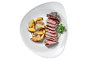 Sliced Grilled rump Beef steak with potato. Isolated, white background.