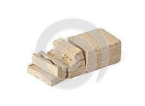 Sliced halva isolated on a white background. Traditional oriental dessert photo