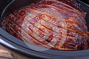 Sliced ham cooked in a slow cooker