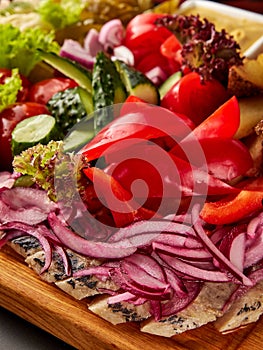 Sliced herring served with assorted vegetables
