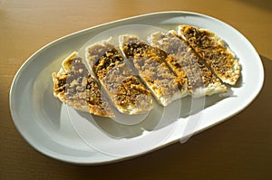 Sliced Iberian cachuela bread toast photo