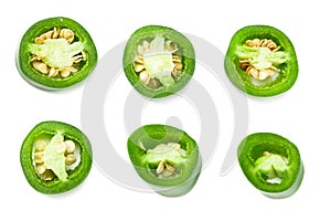 sliced jalapeno peppers isolated on white background. Green chili pepper. Capsicum annuum. top view