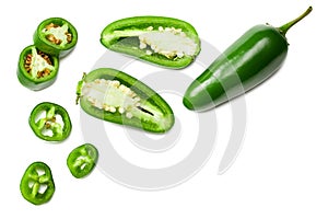 sliced jalapeno peppers isolated on white background. Green chili pepper. Capsicum annuum. top view photo