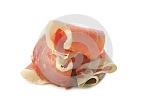 Sliced jamon of ham folded on white