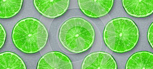 Sliced juicy lime on a gray background. Fresh fruits. Fruit background. Summer party. Birthday