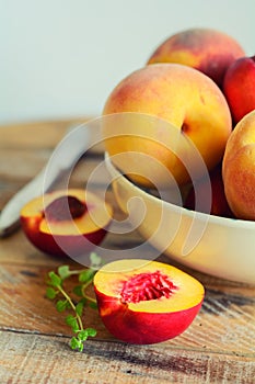 Sliced juicy peach in dish