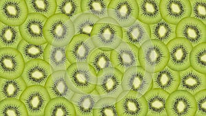 Sliced kiwi fruit pattern background
