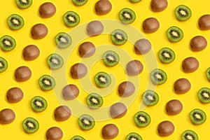 Sliced kiwi fruits isolated on yellow background